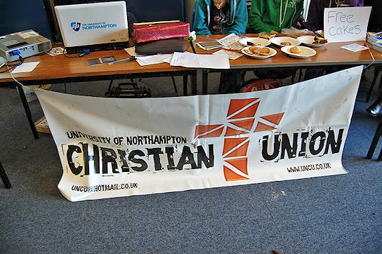 Christian Union stall with sign for free cakes