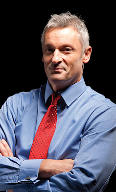 Portrait of Nick Petford, with shirt and tie but no jacket