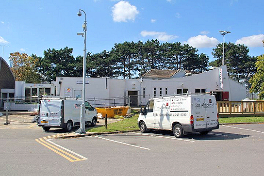 Students' Union with two builders' vans in the foreground